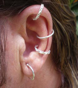 Braided and solid non-piercing body rings worn on the ear