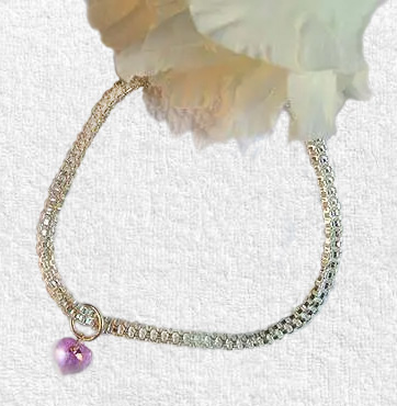 Silver ankle chain jewellery worn around a woman's ankle