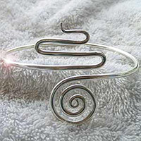 Custom made silver snake arm band jewellery.