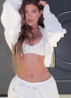 Kylie Jenner wearing a gold waist chain