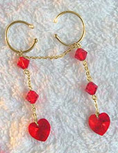Gold pussy dangle jewellery with ruby Swarovski Love Heart