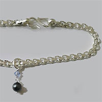 Silver anklet and ankle chain jewellery.