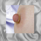 twisted double wrap gold nipple ring worn as breast jewellery