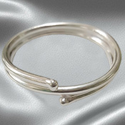 Solid silver adjustable cock ring.