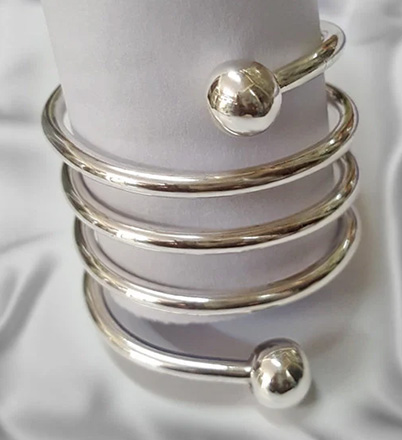 Four turn spiral cock ring worn beneath the glans