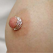 Braided double wrap silver nipple ring worn on the breast
